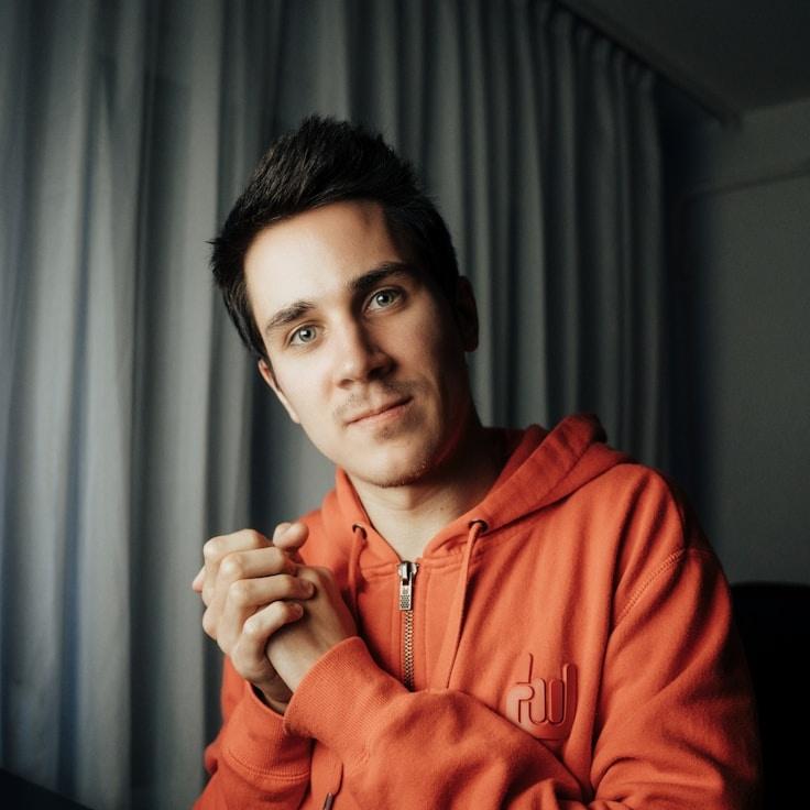 Kaveri Mehta, Lead Design Curator at Gentle Brook Field, reviewing corporate floral arrangements